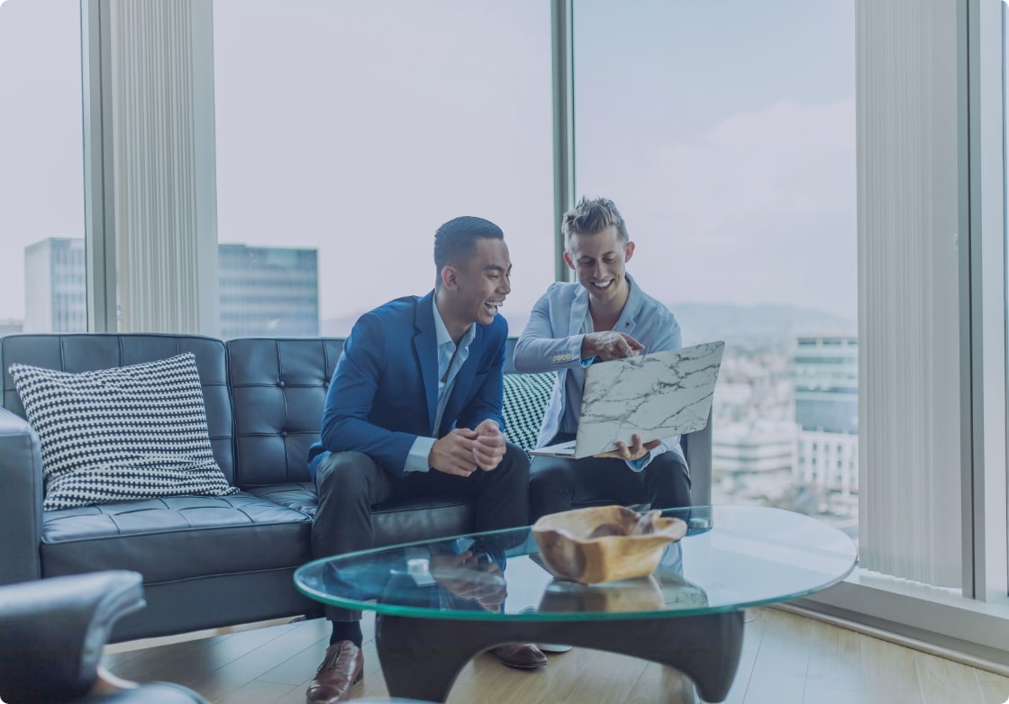 Advisors meeting in a high-rise office overlooking the city